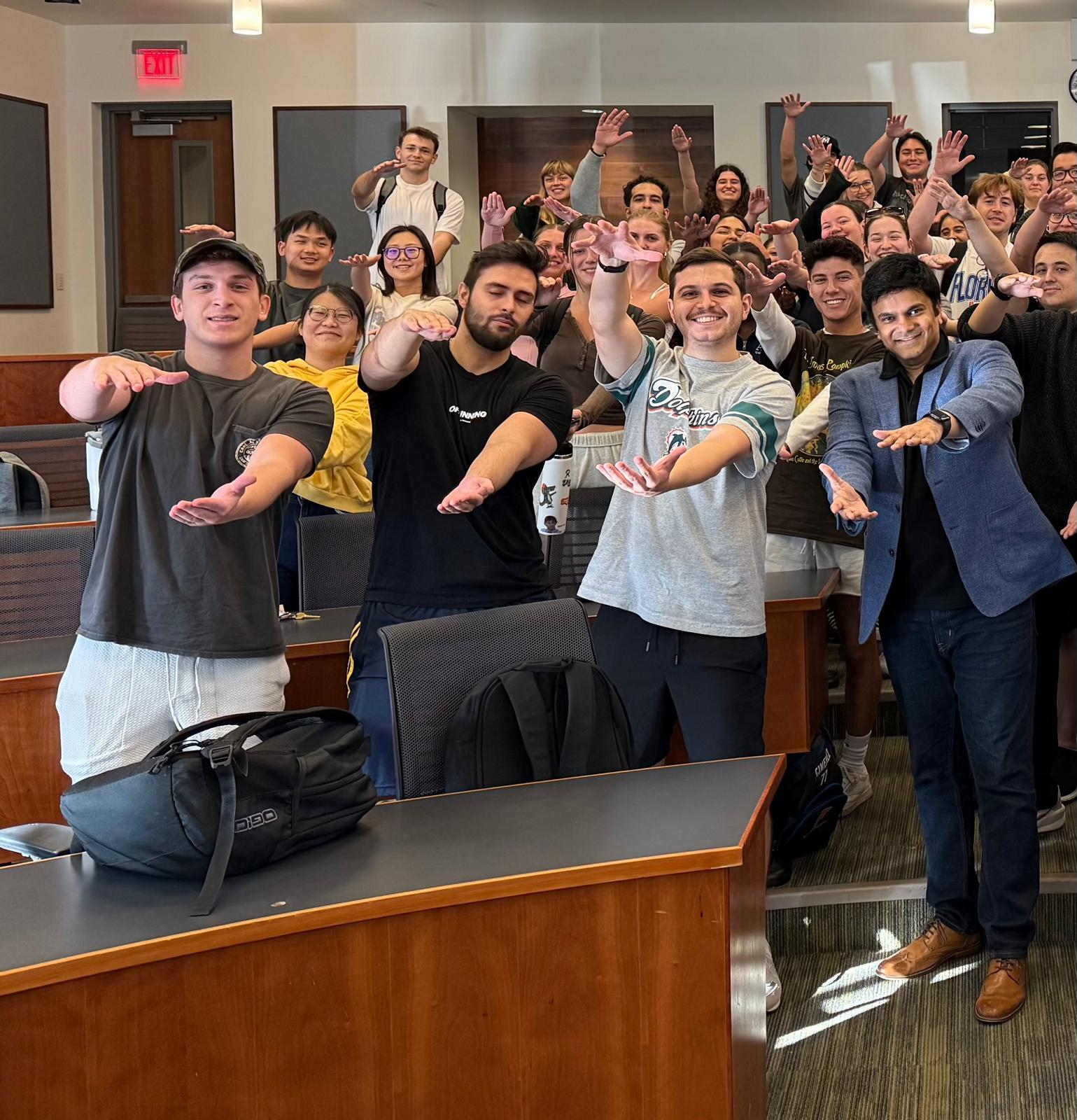 Aakash Andrews with participants in a classroom